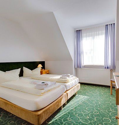 Hotel Zwickau Mosel.Doppelzimmer Komfort.hotels/9581e39b2056ac97e9334c758e95e9d95aed12a2/room/hotel-zwickau-mosel-doppelzimmer-komfort-89708.jpg